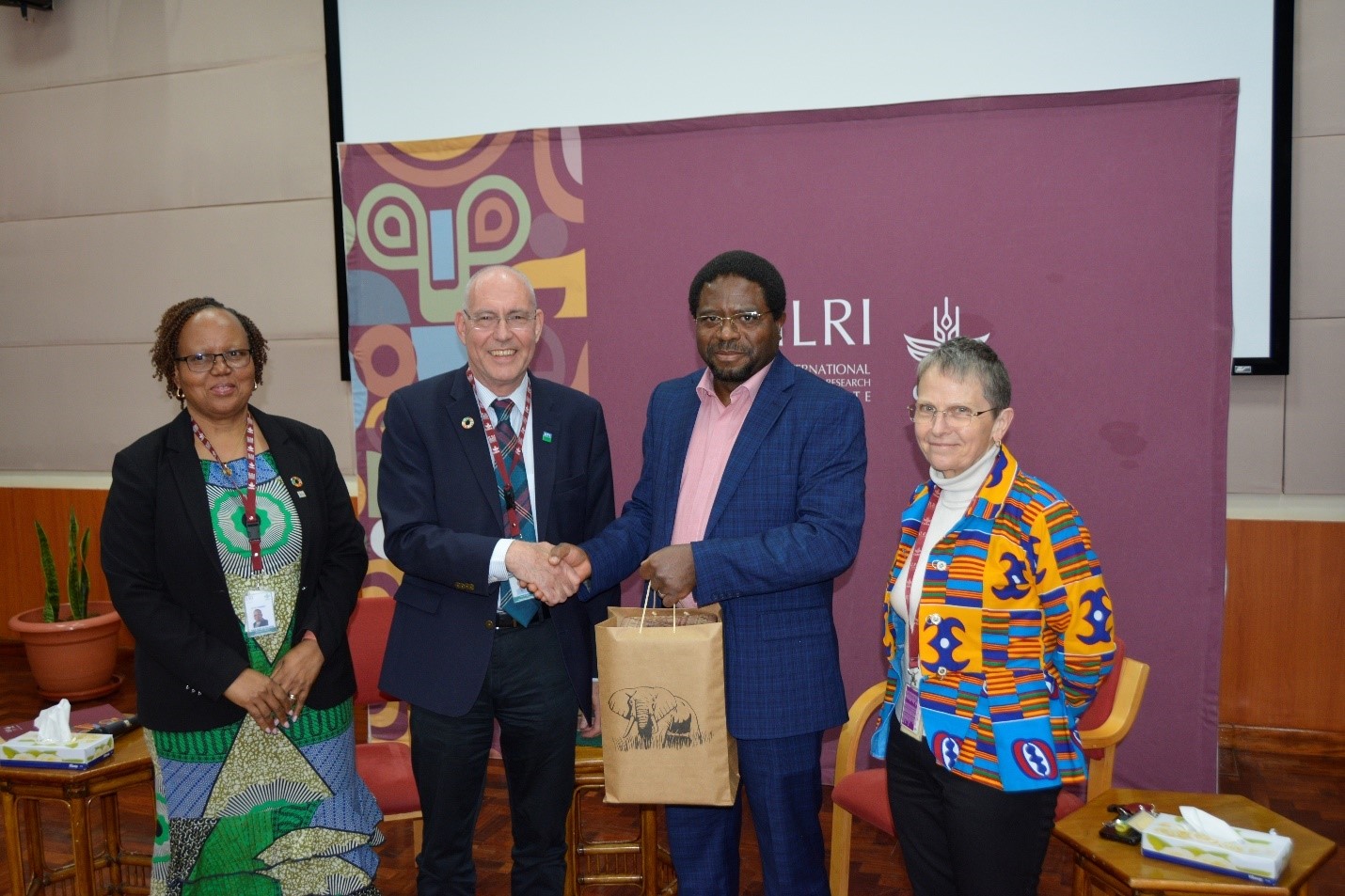 From left to right, Siboniso Moyo, Iain Wright, Appolinaire Djikeng, and Shirley Tarawali. Photo: Fenja Tramsen/ ILRI. 