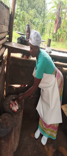 A person in a white apron and white skirt</p>
<p>Description automatically generated