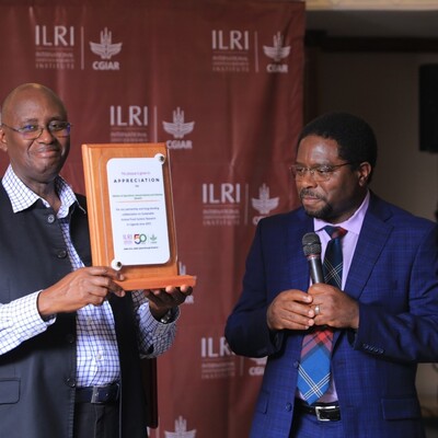 International Livestock Research Institute (ILRI) director general, Apollinaire Djikeng (right), presented a plaque to the Minister of State for Animal Industry, Hon. Bright Rwamirama, in appreciation of the support accorded to the ILRI by the ministry over the past 12 years (photo credit ILRI/Go Promotions).