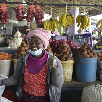 Vendor with fresh produce at Soko Mpya Market, Nyandarua County Photo: Fenja Tramsen/ ILRI.