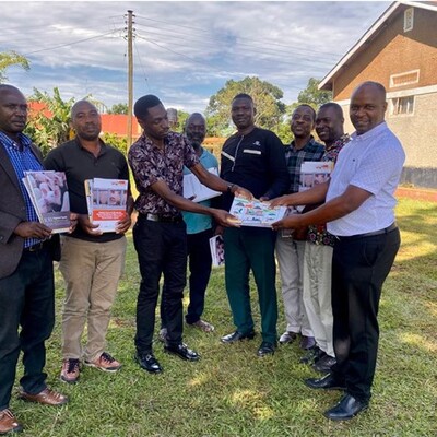 Grace Asiimwe (extreme right) and some of the extension workers after receiving the training materials (photo credit: MAAIF) PigSmart materials