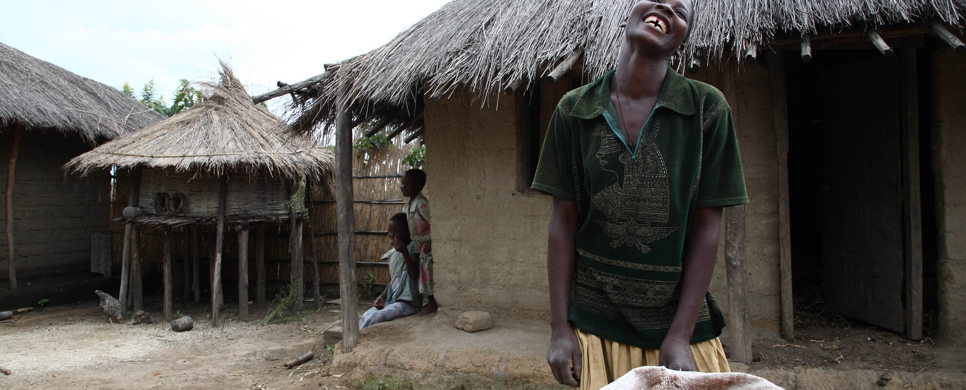 Livestock farmer Jinny Lemson with her bean harvest in central Malawi (photo credit: ILRI).