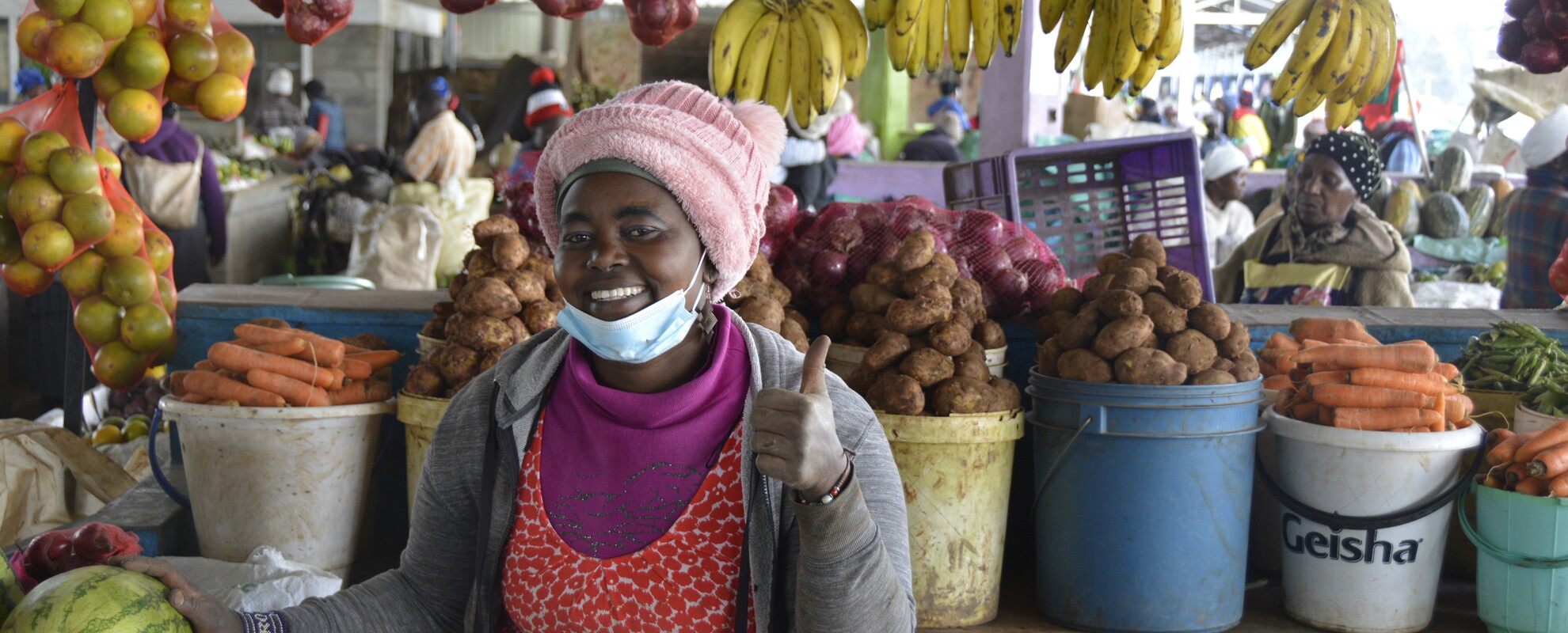 Vendor with fresh produce at Soko Mpya Market, Nyandarua County Photo: Fenja Tramsen/ ILRI.