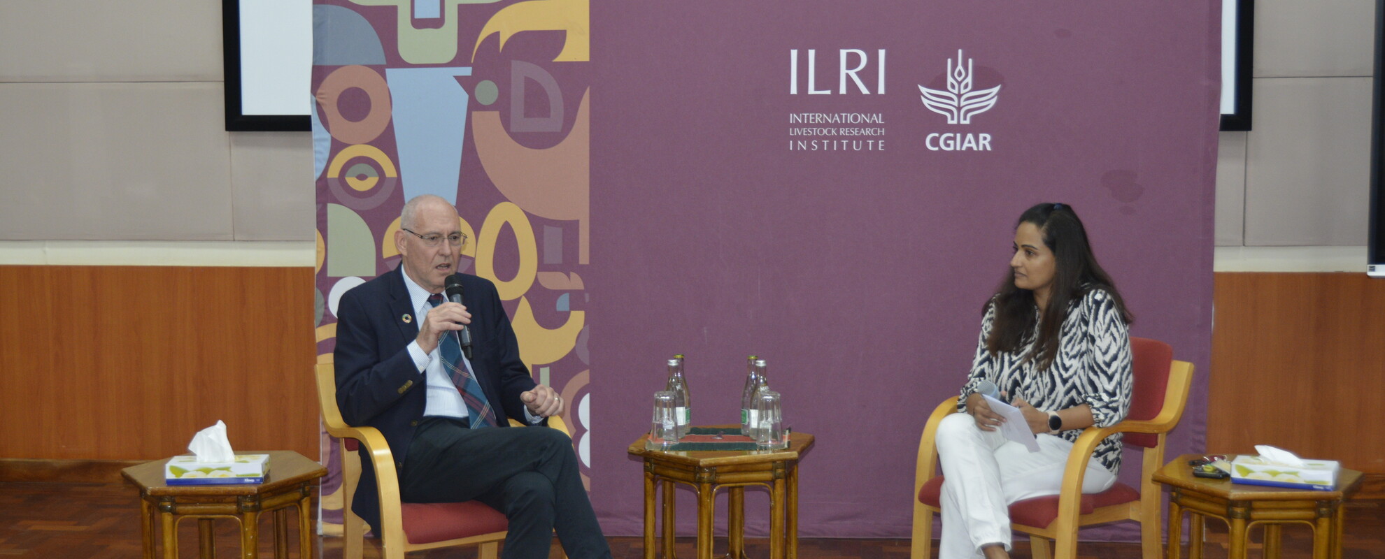 Iain Wright and Ekta Patel discussing Iain’s career during the fireside chat. Photo: Fenja Tramsen/ ILRI. 